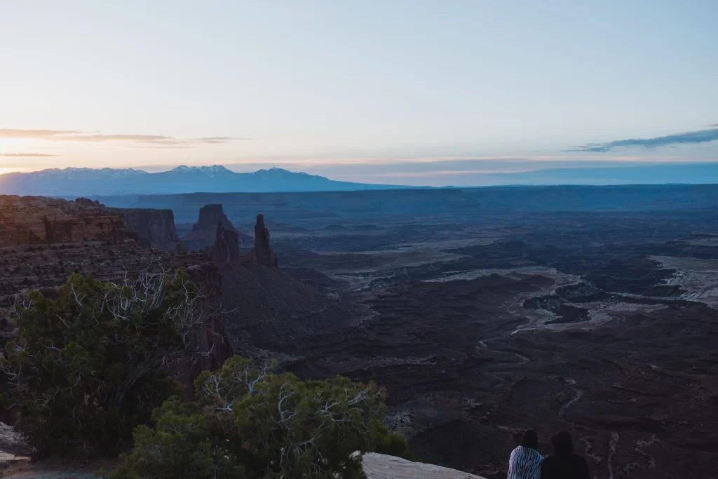 sunrise at mesa arch couple